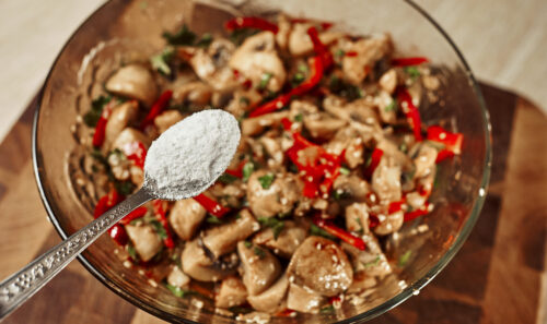 Adding salt to the marinated mushroom salad