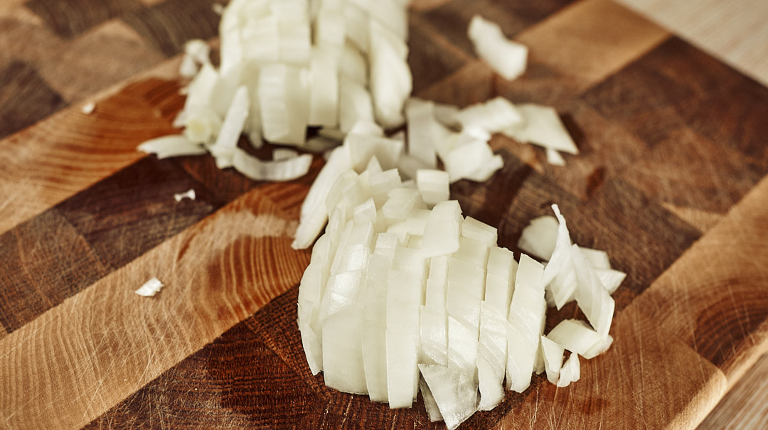Onion and bell pepper prep for mushroom salad