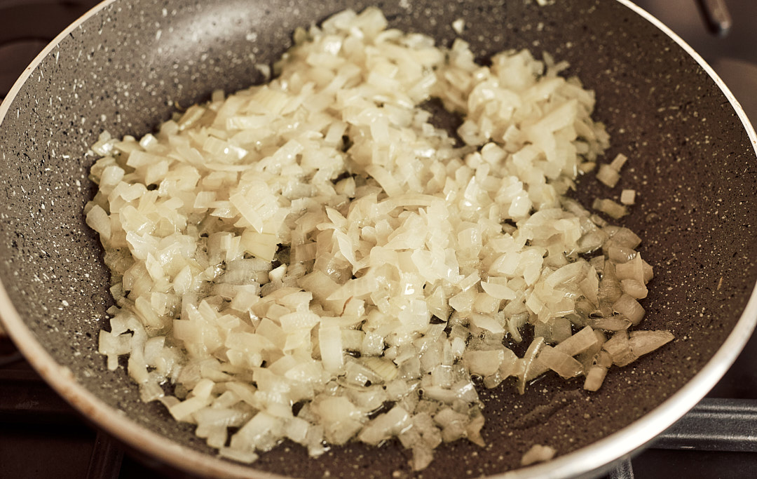 Onion sautéing in a skillet