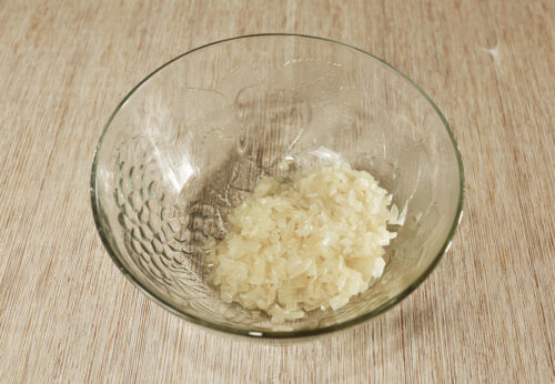 Chopped onion in a glass bowl