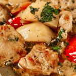 Braised potatoes with pork served in a skillet