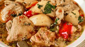 Braised potatoes with pork served in a skillet