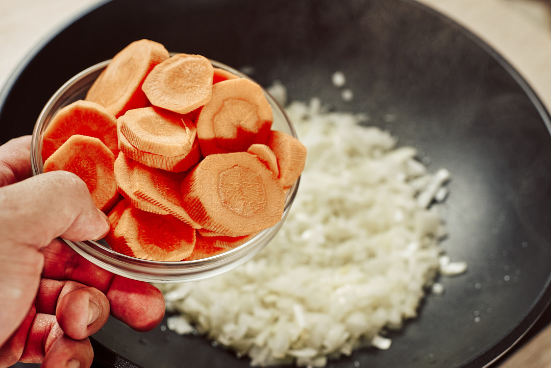 Adding sliced carrots