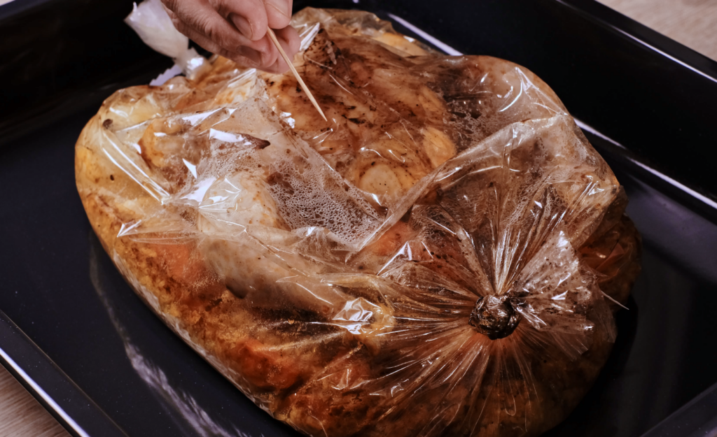 baked chicken and rice in roasting bag opened