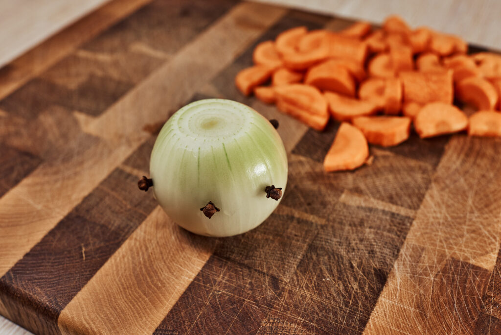 onion with cloves and chopped carrot