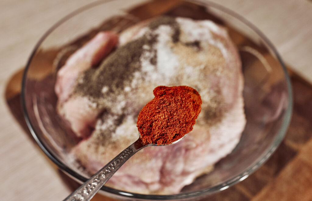 adding paprika to chicken for color and flavor