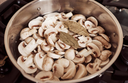 Boiled mushrooms drained and ready to cool