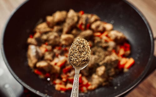Adding oregano to stew base