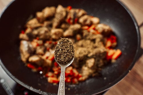 Pork and aromatics simmering