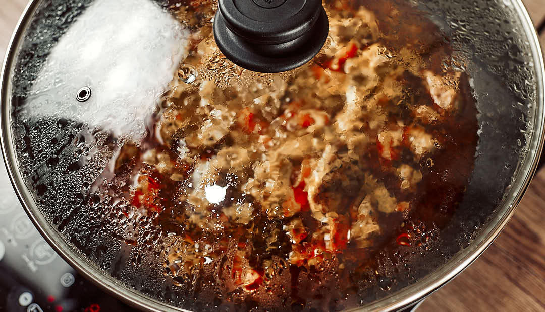 Simmering the stew covered