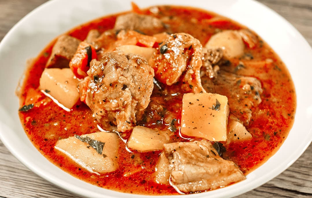 Serving pork stew with bread