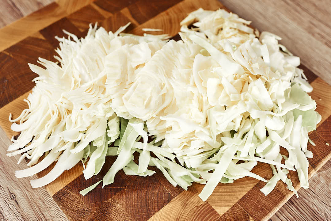 Shredded cabbage on a cutting board