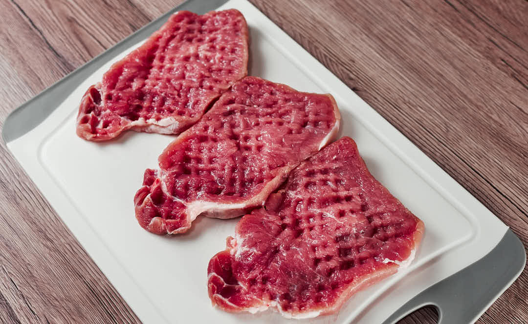 Pounding pork cutlets thin for schnitzel