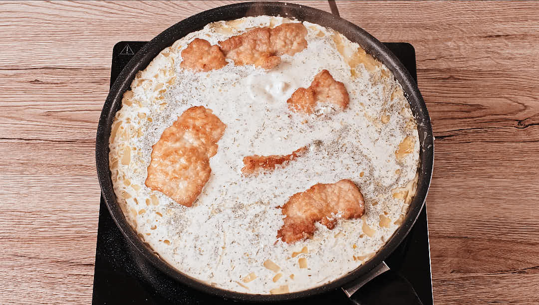 Pork schnitzel with dill garlic cream sauce