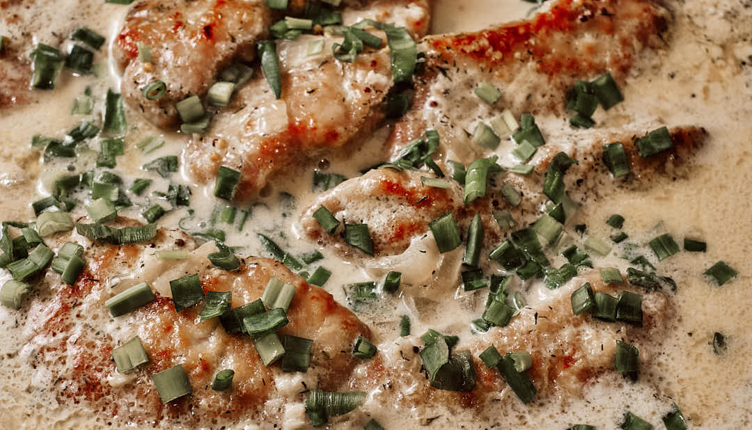 Pork schnitzel served with creamy dill gravy