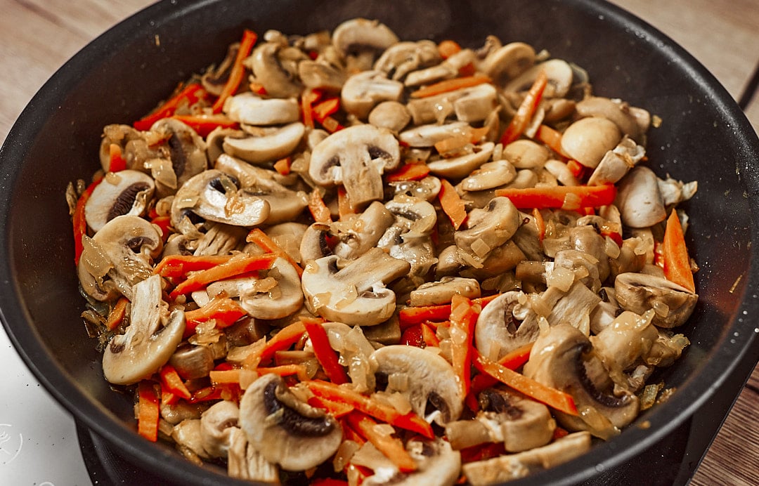 Sautéing onions, carrots, and mushrooms for potato soup