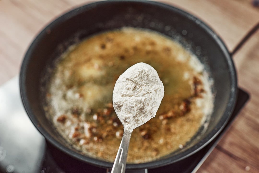 Whisking flour into butter for gravy