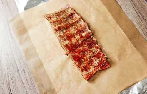 Seasoned ribs ready for the oven