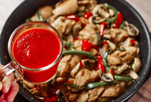 Simmering tomato passata with vegetables 