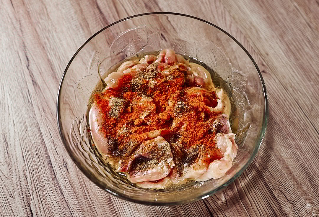 Seasoned chicken thighs ready to cook