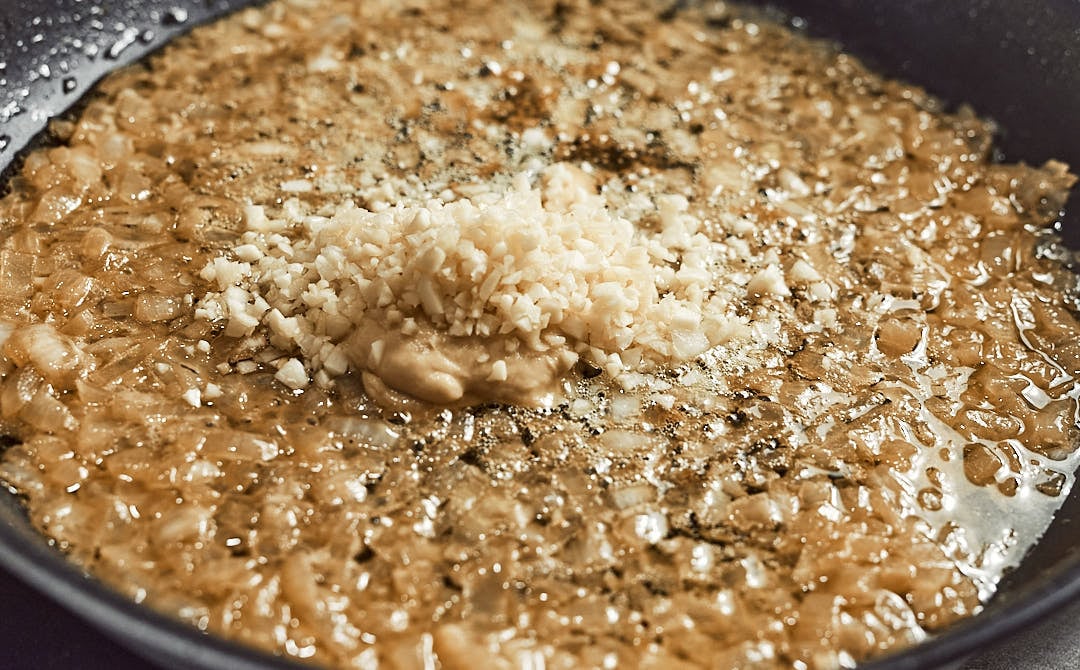 Mixing garlic and mustard for chicken sauce