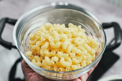 Uncooked elbow pasta ready to be boiled