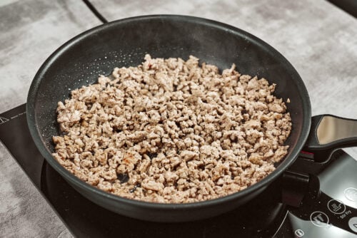 Ground meat browning in a skillet