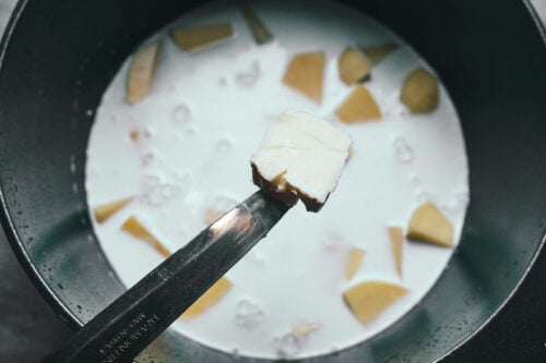 Butter added to potatoes in cream