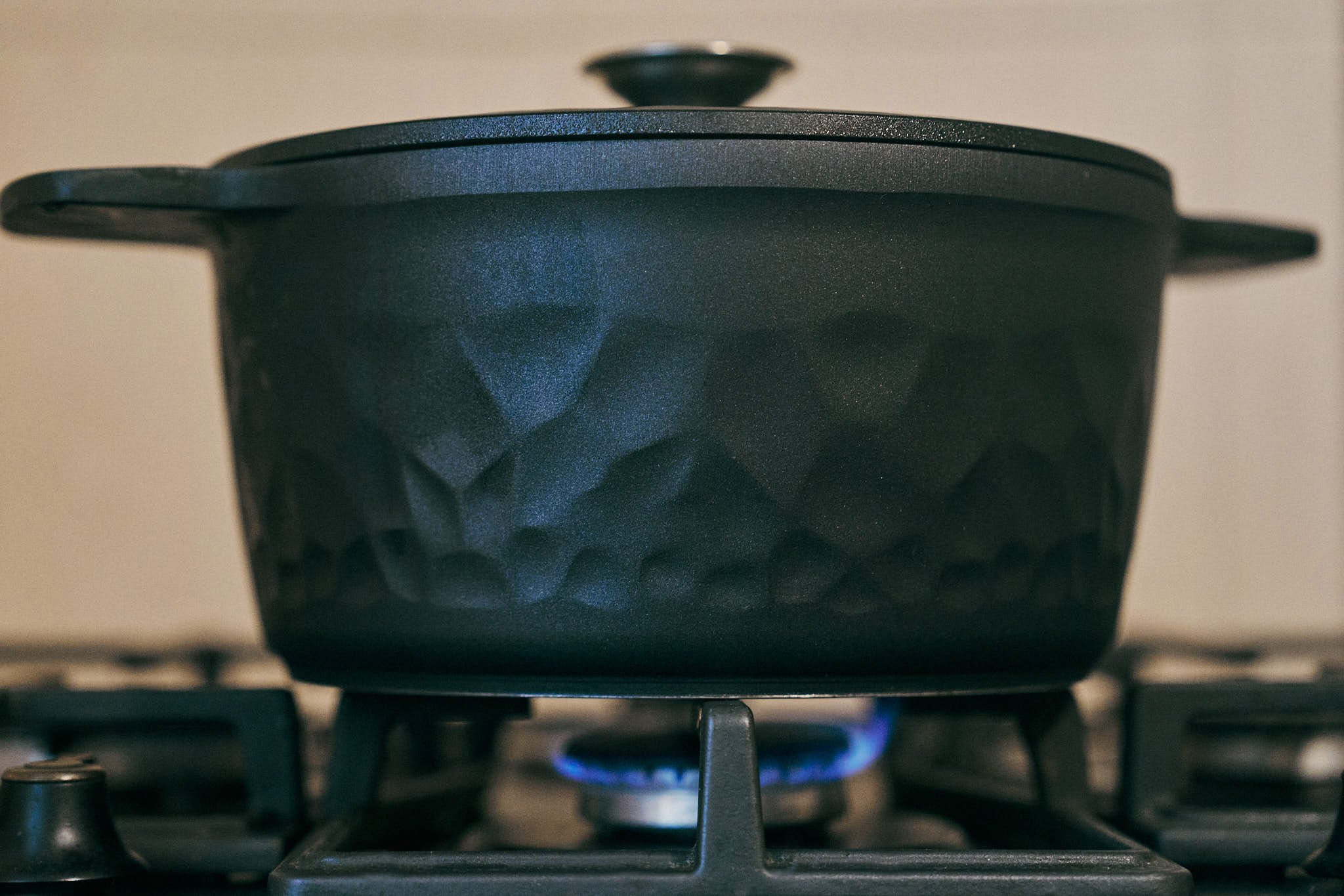 Covered pot simmering on stove