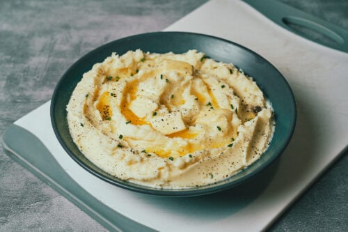 Spoonful of creamy mashed potatoes ready to serve