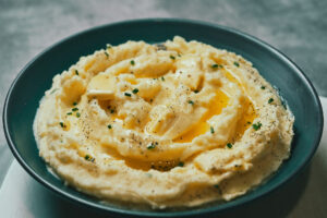 Finished mashed potatoes in pot, creamy and smooth