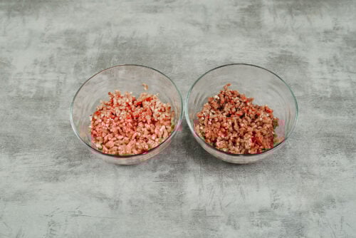 Bowls of ground beef and ground pork prepared for the cabbage roll filling.