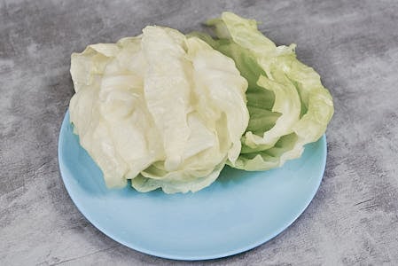 Softened boiled cabbage leaves separated and ready for stuffing.