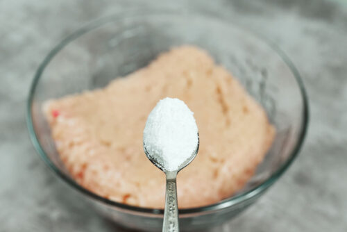 Salt added to ground chicken mixture for chicken meatballs