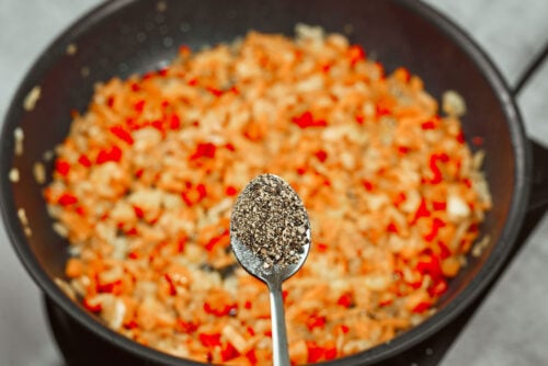Black pepper added to creamy chicken meatballs sauce