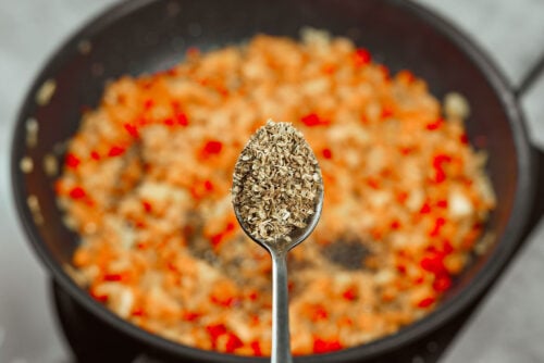 Oregano added to vegetable sauce for chicken meatballs
