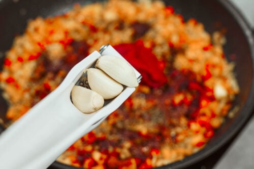 Garlic added to creamy vegetable sauce for chicken meatballs