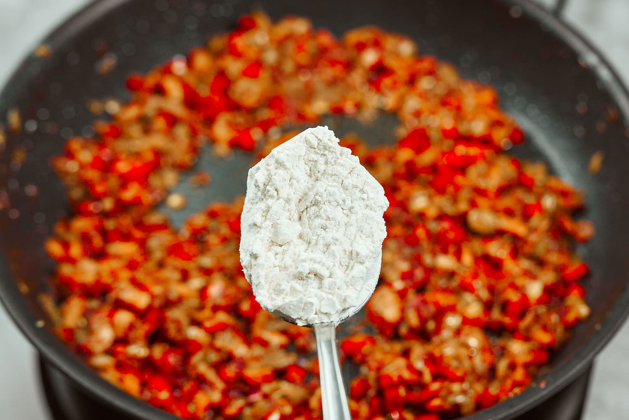 Flour added to sauce to thicken chicken meatballs gravy