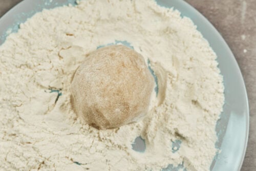 Chicken meatball coated in flour before cooking
