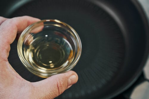 Adding oil to a skillet for beef stroganoff