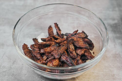 Seared beef removed from the pan for beef stroganoff