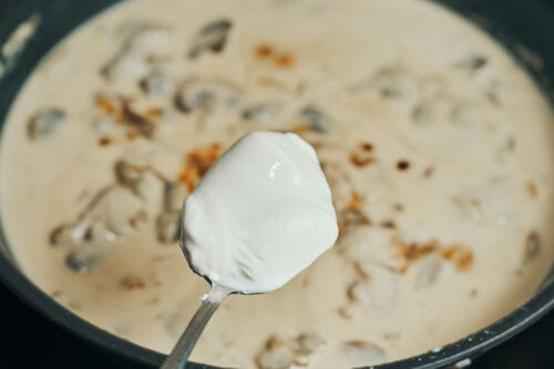 Adding sour cream to make beef stroganoff creamy