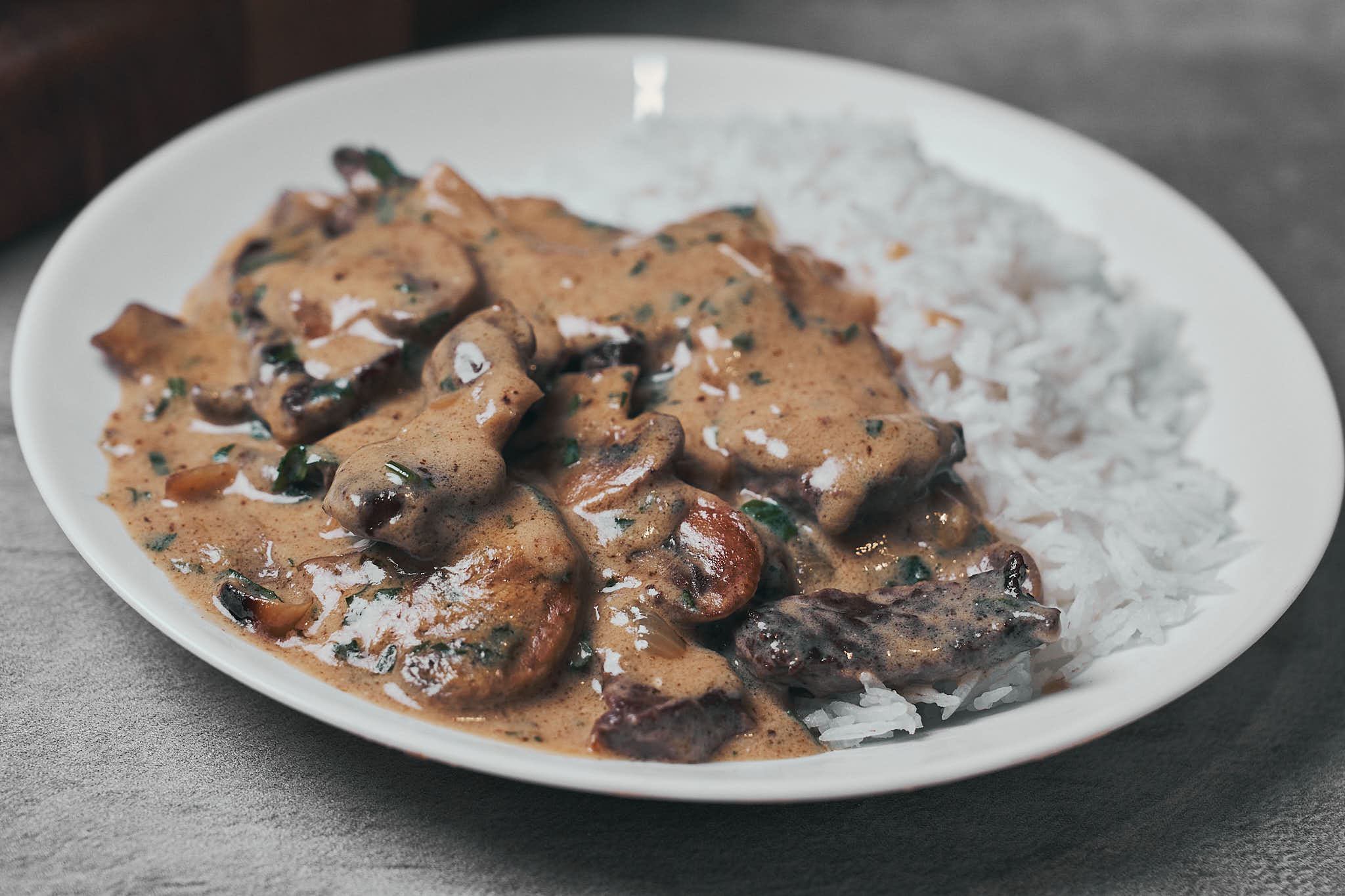 Creamy beef stroganoff with mushrooms in a skillet