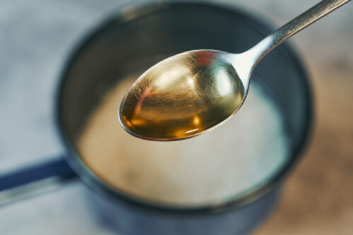 Adding oil to rice while cooking