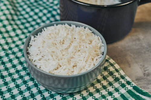 Perfectly cooked white rice in a ceramic bowl