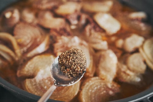Black pepper added to slow simmered beef and onions