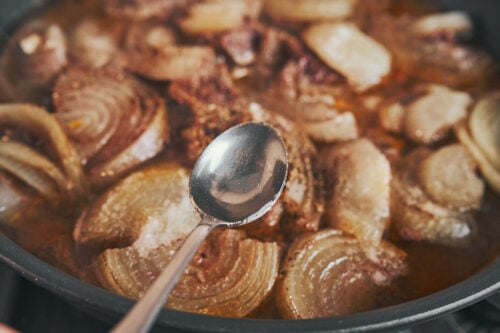 Vinegar added to garlic butter beef during simmering
