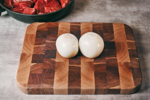 Whole onions prepared for garlic butter beef
