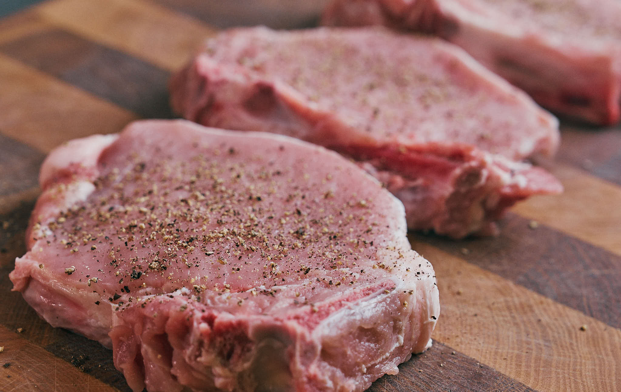 Bone-in pork chop seasoned with black pepper
