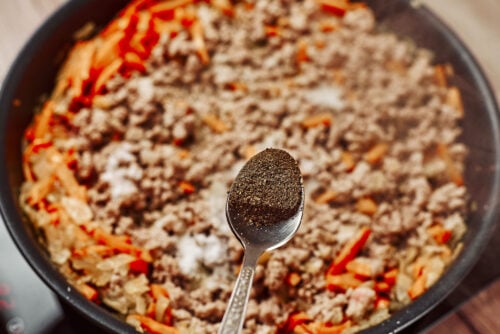 Black pepper added to ground beef mixture while cooking